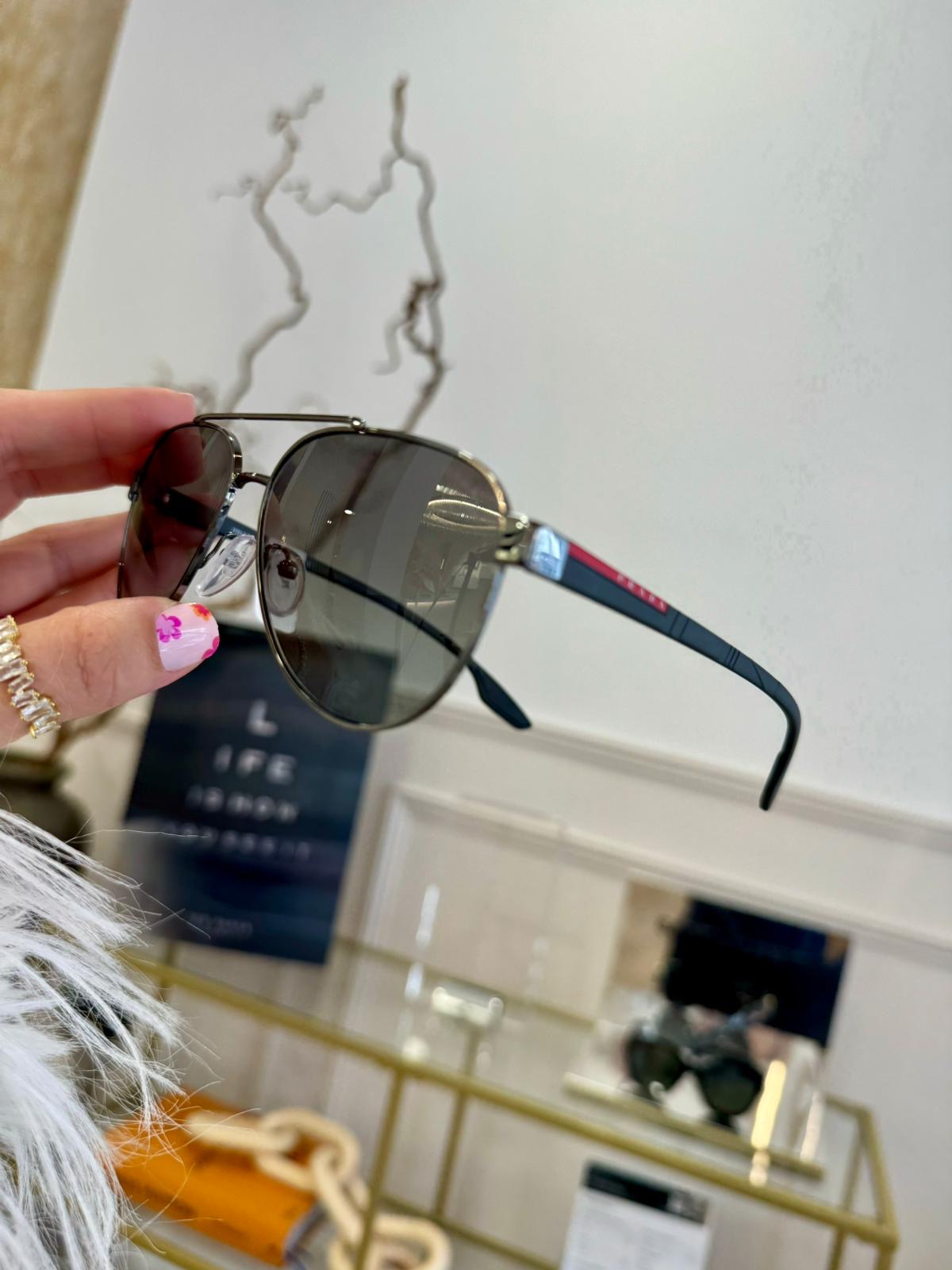 Prada linea rossa sunglasses at Edwards & Walker Opticians Doncaster