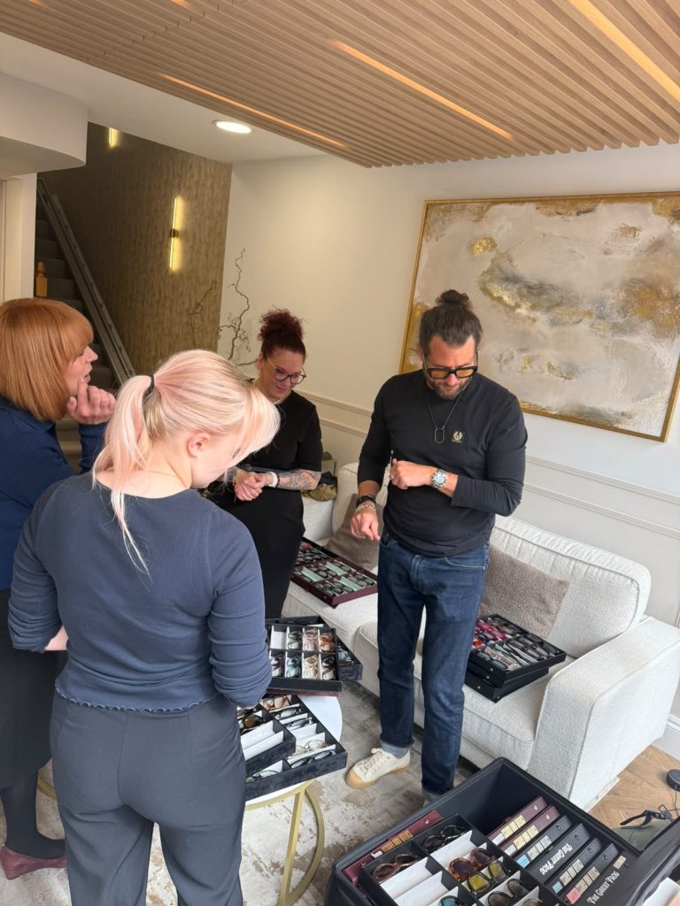 Eyewear designer presenting Cutler and Gross frames to the Edwards & Walker team during an exclusive in-practice styling and product training session.