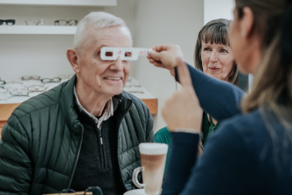 Staff member measuring a patient's pupillary distance at Edwards & Walker Opticians in Doncaster